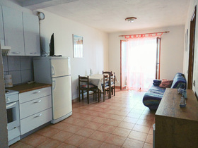 obývací pokoj s kuchyňským koutem
